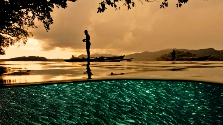 Papuan fisherman Raja Ampat Indonesia